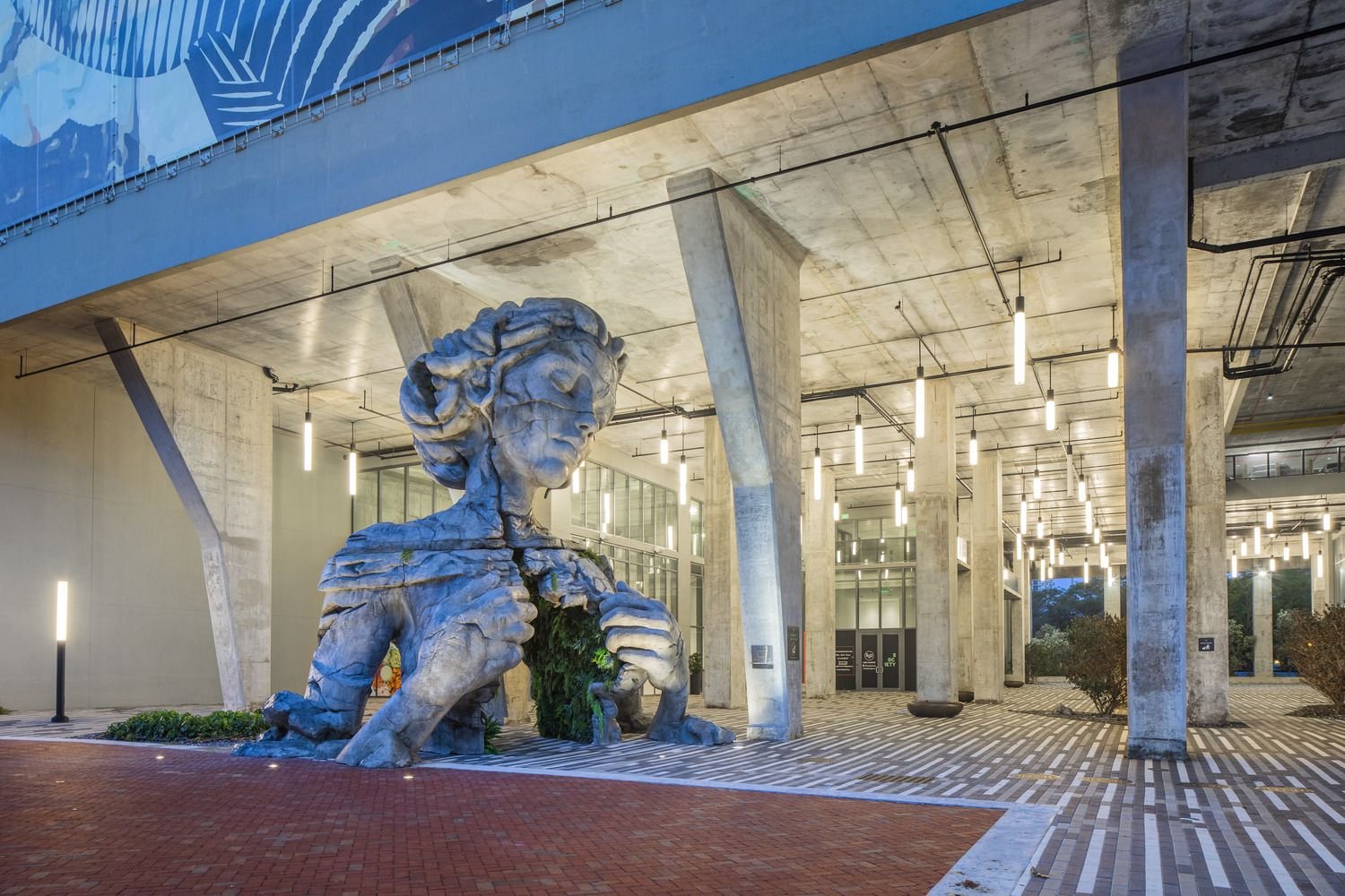 Covered plaza at the base of a mixed-use building
